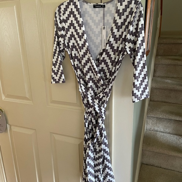 Faux wrap dress/ belt in small.  Black and white print.  3/4 sleeves. length 40” - Picture 2 of 2